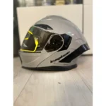 Siva flip-up kaciga sa integrisanim naočarima za motor